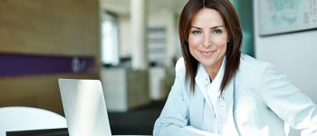 Shot of a businesswoman working at a laptop in an office